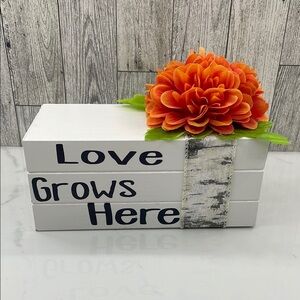 Decorative White Boock with Orange Flower Accent